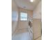 Laundry room with washer, dryer, shelving and window at 6710 Cinnamon Cir, Mint Hill, NC 28227