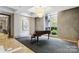 Elegant lobby with grand piano and seating area at 230 S Tryon St # 704, Charlotte, NC 28202