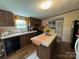 Kitchen with island, wood cabinets, and appliances at 280 Deerfield Estates Ln, Stony Point, NC 28678