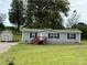 Gray mobile home with shed and yard; front view at 280 Deerfield Estates Ln, Stony Point, NC 28678