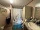 Clean bathroom with a tub and granite vanity at 280 Deerfield Estates Ln, Stony Point, NC 28678