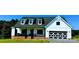 Modern farmhouse with a large front yard and gravel driveway at 215 Autumn Rd, Harmony, NC 28634