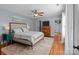 Main bedroom with king-size bed and hardwood floors at 8244 Dumphries Dr, Huntersville, NC 28078