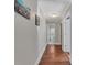 Hardwood floor hallway with access to bathroom and bedrooms at 5220 Seacroft Rd, Charlotte, NC 28210