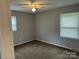 Spacious bedroom featuring carpet, ceiling fan, and two windows at 2307 Dallas Stanley Hwy, Stanley, NC 28164