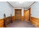 Bedroom with wood-paneled walls and a closet at 902 Coldwater Ct, Concord, NC 28025