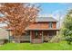 Beautiful log home nestled in a wooded setting, featuring a wrap-around porch and stunning curb appeal at 902 Coldwater Ct, Concord, NC 28025