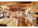Open kitchen with granite counters, stainless steel appliances, and wood cabinets at 902 Coldwater Ct, Concord, NC 28025