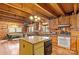 Spacious kitchen with wood cabinets, granite island, and wood floors at 902 Coldwater Ct, Concord, NC 28025