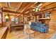 Open concept living room with a piano, exposed beams, and views into the kitchen at 902 Coldwater Ct, Concord, NC 28025