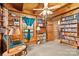 Relaxing office with bookshelves, comfy chair, and wood accents at 902 Coldwater Ct, Concord, NC 28025