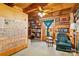 Cozy office with wood walls, built in shelves, and a comfy armchair at 902 Coldwater Ct, Concord, NC 28025