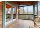 Screened porch with wooden floors and views of the surrounding woods at 902 Coldwater Ct, Concord, NC 28025
