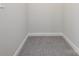 Small walk-in closet with grey carpeting at 2642 Roseglen Ln, Indian Land, SC 29707