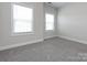 Well-lit bedroom with neutral walls and carpet flooring at 2642 Roseglen Ln, Indian Land, SC 29707