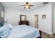 Bright bedroom with a king-size bed and ensuite bathroom access at 14613 Glenduff Pl, Charlotte, NC 28278