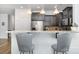 Kitchen breakfast bar with two gray barstools at 14613 Glenduff Pl, Charlotte, NC 28278