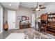 Bright home office with hardwood floors, built-in shelving and desk at 3020 Poplar Hill Rd, Charlotte, NC 28270