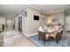 Elegant dining room with a marble table, comfortable seating, and hardwood floors at 3020 Poplar Hill Rd, Charlotte, NC 28270