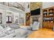 Two-story great room boasts a stone fireplace and built-in shelving at 106 Liva Ln, Mooresville, NC 28117