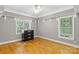 Bedroom with hardwood floors, ceiling fan, and built-in shelving at 106 Liva Ln, Mooresville, NC 28117