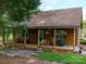 Charming log cabin with a spacious front porch at 8771 Lower Rocky River Rd, Concord, NC 28025