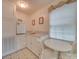 Small kitchenette with white cabinetry and a round table at 8771 Lower Rocky River Rd, Concord, NC 28025