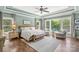 Spacious main bedroom with hardwood floors and views to the backyard at 127 Tradition Ln, Mooresville, NC 28115