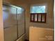 Clean bathroom with shower/tub combo and window at 1701 W A St, Kannapolis, NC 28081