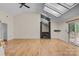 Living room with hardwood floors, fireplace, and skylights at 1720 12Th Ne St, Hickory, NC 28601