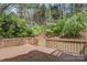 Deck overlooks a wooded area with a gate at 1720 12Th Ne St, Hickory, NC 28601