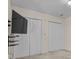 Bright bedroom featuring wall-mounted TV and double closets at 1720 12Th Ne St, Hickory, NC 28601