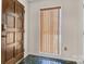 Inviting entryway with a wood door and vertical blinds at 1720 12Th Ne St, Hickory, NC 28601