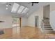 Bright living room featuring hardwood floors, skylights, and access to a deck at 1720 12Th Ne St, Hickory, NC 28601