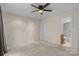 Bedroom with ceiling fan and adjacent bathroom at 1720 12Th Ne St, Hickory, NC 28601