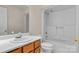 Neat bathroom with shower/tub combo and wood vanity at 1720 12Th Ne St, Hickory, NC 28601