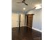 Spacious bedroom with dark hardwood floors and a rustic barn door at 12136 Renee Ford Rd, Stanfield, NC 28163