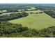 Aerial view of property with pond and road access at 12136 Renee Ford Rd, Stanfield, NC 28163