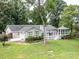 Ranch home with deck, screened porch, and landscaping at 12136 Renee Ford Rd, Stanfield, NC 28163