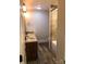 Clean bathroom with double vanity, granite countertops, and a shower/tub combo at 12136 Renee Ford Rd, Stanfield, NC 28163