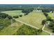 Aerial view of property with home and pool nearby at 12136 Renee Ford Rd, Stanfield, NC 28163