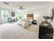 Cozy bedroom with wood headboard and plush carpeting at 110 Quiet Trl, Mooresville, NC 28117