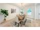 Elegant dining room featuring a wooden table and chandelier at 110 Quiet Trl, Mooresville, NC 28117