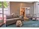 Inviting screened porch with wicker furniture and a blue rug at 1602 Huntmoor Dr, Rock Hill, SC 29732