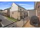 Townhouse community exterior view with a balcony and grilling area at 12119 Brooklyn Ave, Charlotte, NC 28204