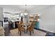 Bright kitchen with stainless steel appliances and adjacent dining area with seating for four at 12119 Brooklyn Ave, Charlotte, NC 28204