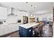 Modern kitchen featuring a center island with a breakfast bar and stainless steel appliances at 12119 Brooklyn Ave, Charlotte, NC 28204