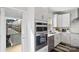 Kitchen with double oven, modern cabinetry, and a view of a community at 12119 Brooklyn Ave, Charlotte, NC 28204