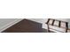 Dark brown hardwood flooring with white baseboards at 12119 Brooklyn Ave, Charlotte, NC 28204
