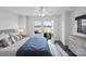 Main bedroom with a king-size bed, access to a balcony, and modern decor at 12119 Brooklyn Ave, Charlotte, NC 28204